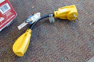 lot 507 image: Camco Power Grip RV Adapter 50A Male to 30A Female