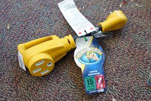 lot 509 image: Camco Power Grip RV Adapter 15A Male to 50A Female