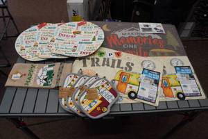 lot 249 image: Assorted Camping Themed Textiles -Rug, Placemats, Hot Pad, Dish Towel