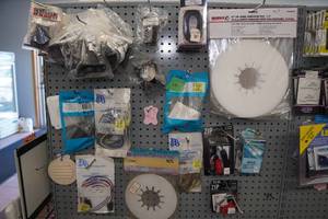lot 530 image: Assorted RVTrailer Accessories -Plug Guards, Mirror Straps, Wheel Lubricator Discs