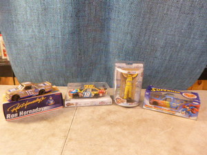lot 118 image: NASCAR Die-Cast Cars and Kyle Busch Figurine