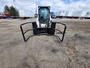 lot 10 image: NEW Wolverine BSH-12-750 Skid Steer Bale Speargrapple Attachment