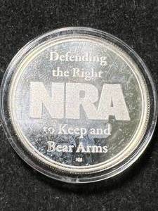 lot 23 image: 1 TROY OZ .999 FINE SILVER NRA ROUND IN AIRTITE