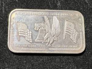 lot 66 image: 1 TROY OZ .999 FINE SILVER INTERNATIONAL TRADE UNIT BAR
