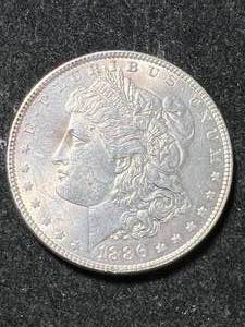 lot 67 image: 1886 US MORGAN SILVER DOLLAR