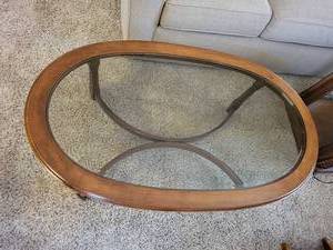 lot 6 image: Elegant Oval Glass Coffee Table
