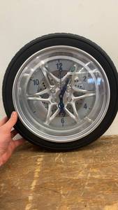 lot 112 image: Tire Rim Wall Clock with Unique Design