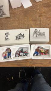 lot 177 image: Holiday-Themed Ceramic Figurine Set with Motorcycle and Sled