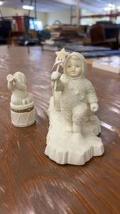 lot 256 image: Winter-Themed Porcelain Figurine Set with Inuit Child and Animals