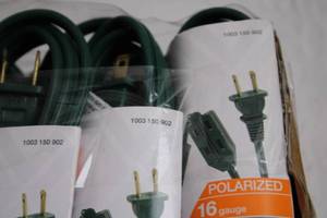 lot 99 image: Group of 6 ft Indoor Extension Cords and 2 in Plastic Sink Strainer