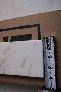 lot 237 image: White Marble Look Porcelain Tile - 30 Inch