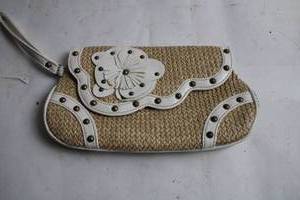 lot 5 image: Woven Straw Shoulder Bag with Floral Accent and Studded Design