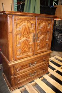 lot 59 image: Vintage Wooden Cabinet with Intricate Carvings and Storage