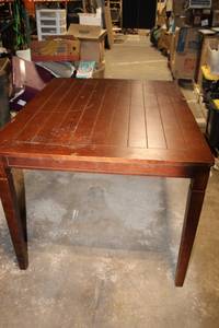 lot 60 image: Wooden Dining Table with Leaf Design Accents