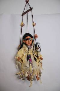 lot 155 image: Native American-Style Hanging Doll with Ornate Costume