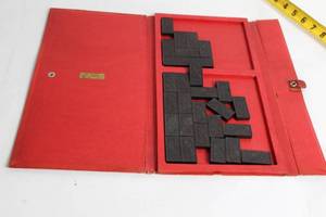 lot 67 image: Vintage Selchow & Righter Co. Dominoes Set in Decorative Red Case
