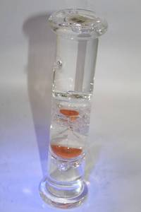 lot 101 image: Glass Sand Timer with Clear Liquid and Orange Sand