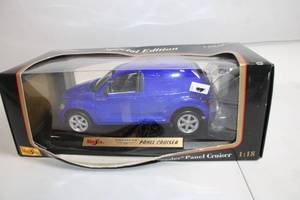 lot 210 image: Maisto 118 Scale Chrysler Panel Cruiser Diecast Model