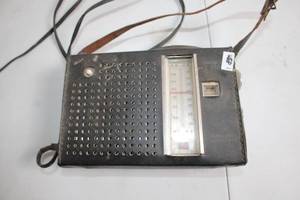 lot 255 image: Vintage AMFM Portable Radio with Leather Strap