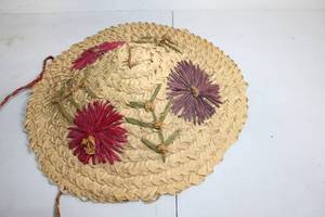 lot 257 image: Handcrafted Woven Straw Hat with Floral Design