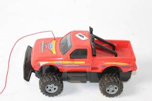 lot 468 image: Used Red Toy Ford Ranger RC Truck with Off-Road Design