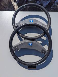 lot 56 image: A pair of 15 and 12-in steering wheels with horn
