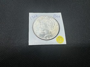 lot 22 image: 1922 Peace Silver Dollar Marked BU When Purchased