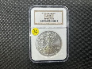lot 34 image: 2001 1 Oz. Silver American Eagle NGC MS69 -  NGC Price Guide $65
