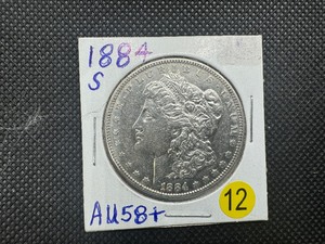 lot 12 image: Key Date 1884-S Morgan Silver Dollar Marked AU58 When Purchased - Greysheet Wholesale Price Guide for an AU58 is $1800