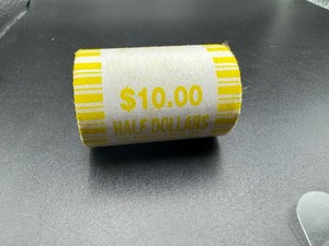 lot 97 image: Unopened Fed Roll Kennedy Half Dollars