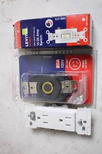 lot 29 image: Leviton 15-20 Amp Switch and Outlet Set