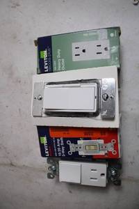 lot 34 image: Assorted Leviton Electrical Outlets and Switches
