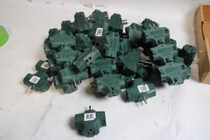 lot 114 image: Collection of 25 Green 3-Outlet Power Adapters