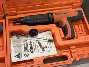 lot 424 image: Ramset Cobra Powder Actuated Fastener for Wood Framing with Operators Manual, Accessories and Plastic Carry Case