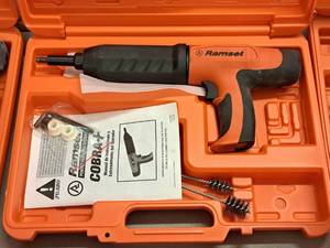lot 427 image: Ramset Cobra Powder Actuated Fastener for Wood Framing with Operators Manual, Accessories and Plastic Carry Case
