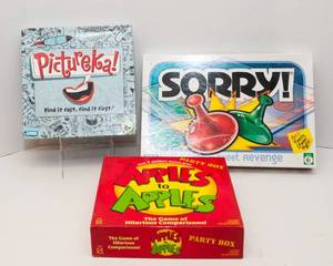 lot 45 image: Three Board Games - Apples to Apples, Pictureka, and Sorry
