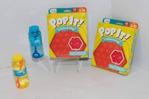 lot 64 image: Chuckle and Roar Pop It Counting Pads and Two Bubbles Bottles