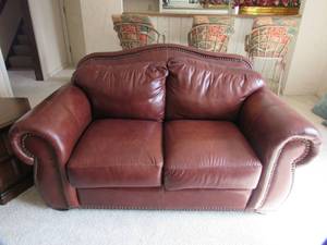 lot 52 image: Classic Leather love seat  Milano Leather designed for Art Van Furniture