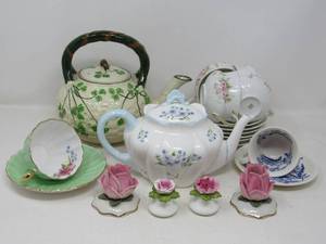 lot 105 image: Tea Party components  2 China Tea Pots, candle holders, saltpepper,  (Aynsley, Haviland, Shelley) and tea cups