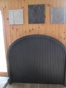 lot 10 image: Large black arched fireplace surrou...