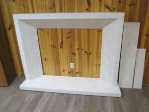 lot 33 image: White on White Concrete Fireplace Surround with 3H x 18D x 74W hearth, Can accommodate up to a 48 W x 40 H fireplace, overall is 70 W x 51 H x 10 D