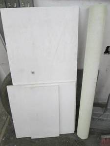 lot 135 image: sheets of PVC and a partial roll of stucco mesh