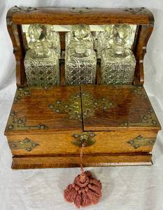 lot 63 image: Antique Tantalus Decanter Box with 3 Decanters and Key