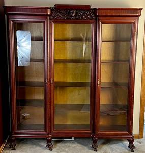 lot 8 image: Antique Mahogany 3 Door Claw Foot Bookcase with Cherub Carving Centerpiece