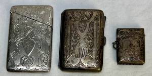 lot 107 image: 3 Sterling Silver Match Cases