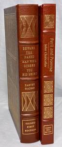 lot 96 image: Signed First Edition Leather Bound Books by Easton Press Peril and Promise and Beware the Naked Man Who Offers You His Shirt
