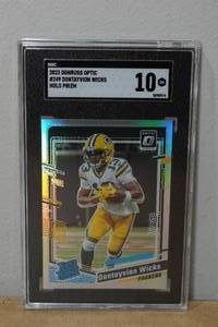 lot 25 image: 2023 Optic Dontayvion Wicks #249 Holo Prizm Rookie Football Card - SGC 10