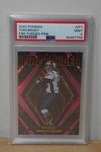 lot 28 image: 2022 Phoenix Tom Brady Fire Forged Pink Football Card - PSA 9