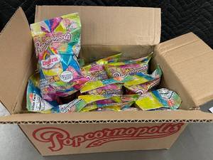 lot 247 image: Box of 12 Unicorn Lemon & Berry Flavored Candy Coated Popcorn Bags