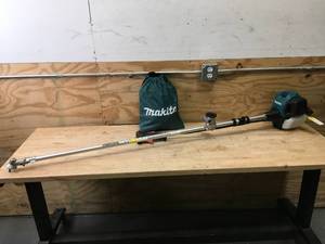 lot 31 image: Makita MM4 Brush Cutter Model # EM2650UH